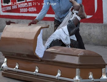 Haiti Earthquake - Man Steeling Dead Man's Coffin
