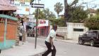 Haiti - Protester throwing rocks at Police