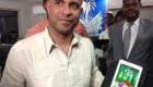 PM Laurent Lamothe holding an Android Tablet MADE IN HAITI