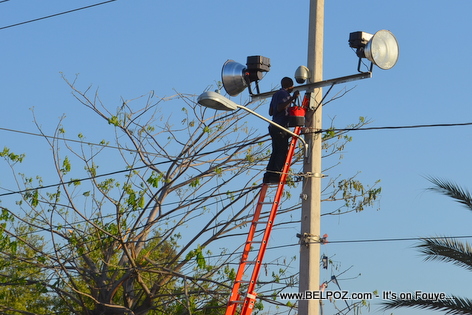 Haiti - EDH installing flood lamps in the streets of Gonaives for Kanaval