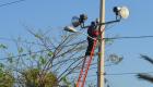 Haiti - EDH installing flood lamps in the streets of Gonaives for Kanaval