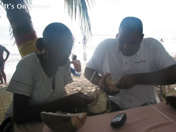 eating coconut at the beach